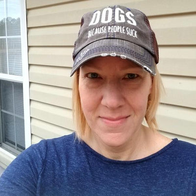 DOGS BECAUSE PEOPLE SUCK DISTRESSED TRUCKER CAP